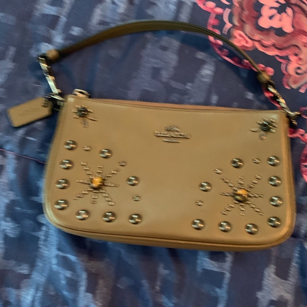 Authentic coach clutch